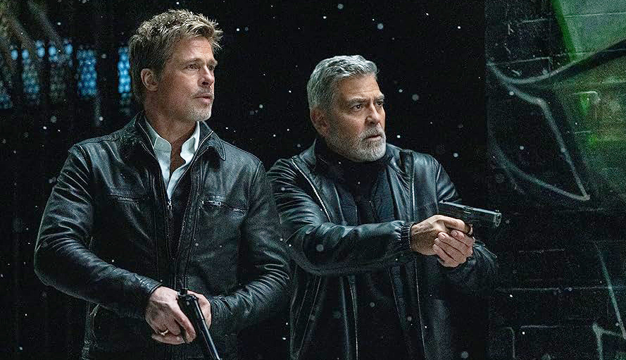 Кадр из фильма «Wolfs». Режиссер: Джон Уоттс. Производство: Apple Studios, Columbia Pictures Corporation, Plan B Entertainment, Smoke House