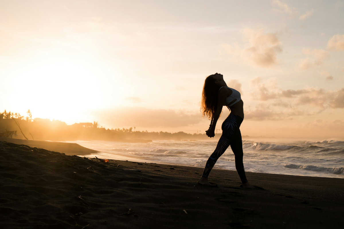 https://unsplash.com/photos/silhouette-of-woman-stretching-her-arms-on-seashore-during-sunrise-u0sviAL9pJM