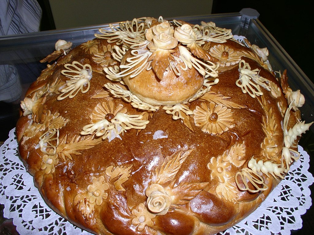 Каравай (вероятно от праслав. *korva — «корова»; др.-рус. корова́й, укр. корова́й, болг. крава́й, сербохорв. кра̀вȃj, словен. kravȃj, krávaj, бел. я́ловiца) — свадебный пшеничный хлеб у славян на коровьем молоке, с куриными яйцами и сливочным маслом, большой, чаще всего круглый, который делят на свадьбе для угощения всех её участников. Обычно искусно украшенный