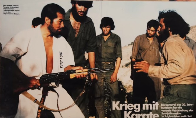 Косиро Танака в лагере подготовки душманов. Он родился в 1940 году в японском регионе Фукуока и в раннем возрасте начал заниматься боевыми искусствами. Изучая такие искусства, как дзюдо, дзюкендо, фехтование, карате и кунг-фу, Танака создал свой собственный стиль, который позже станет известен как Хико Рю Тайдзюцу.