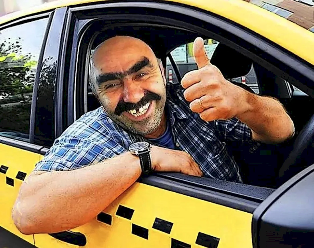 Красивый таксист. Водитель такси. Какой должен быть таксист. Водитель смеется. Фото таксиста в машине.