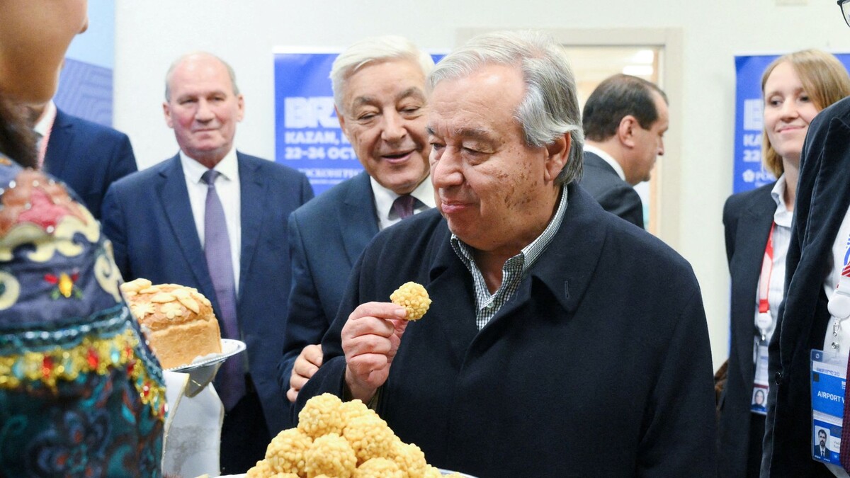 Guterres eating some chak-chak at the BRICS summit in Kazan. Pic: Reuters 