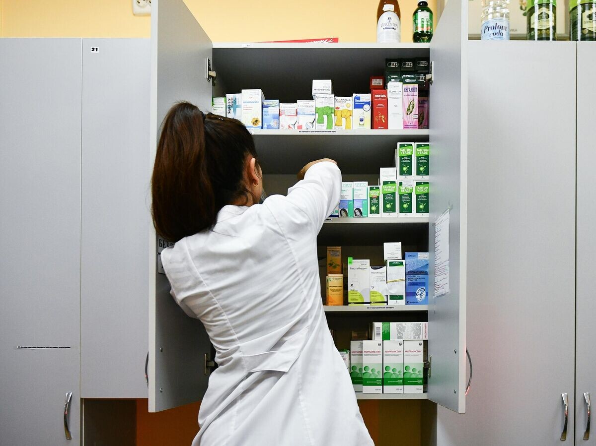    Сотрудница аптеки© РИА Новости / Константин Михальчевский