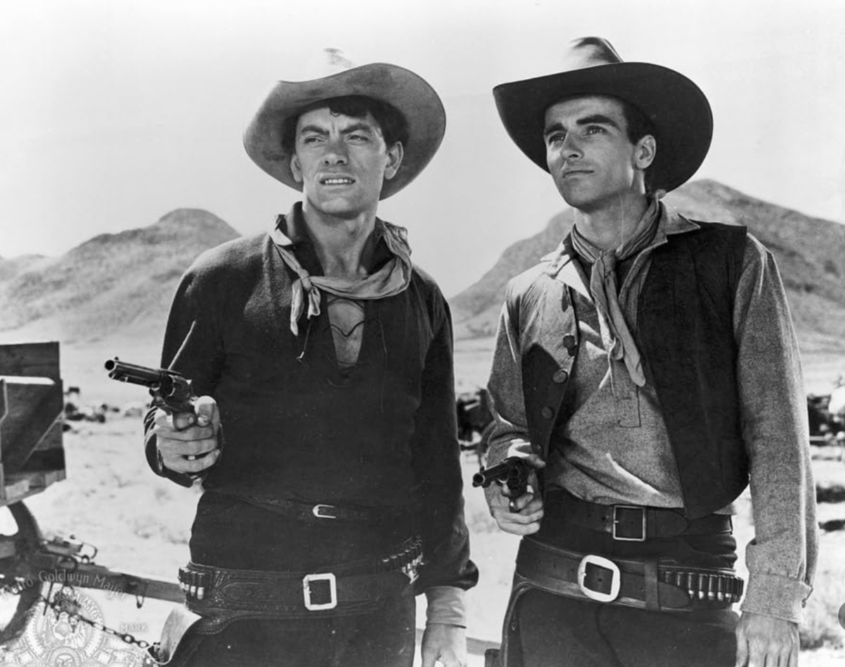 Актер Джон Айрленд и актер Монтгомери Клифт в фильме Говарда Хоукса и Артура Россона «Красная река» (Red River)