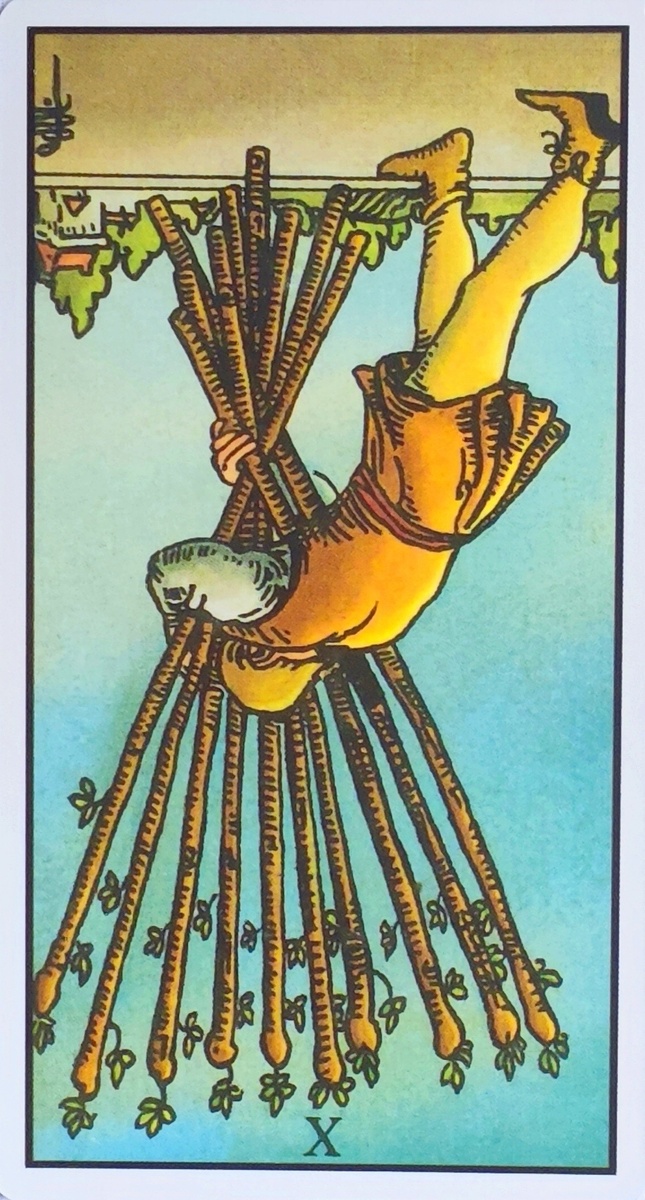 Десятка жезлов. Перевëрнутая карта. 