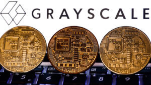    Representation of cryptocurrency and Gayscale logo displayed on a phone screen are seen in this illustration photo taken in Poland on November 6, 2021. (Photo by Jakub Porzycki/NurPhoto via Getty Images)