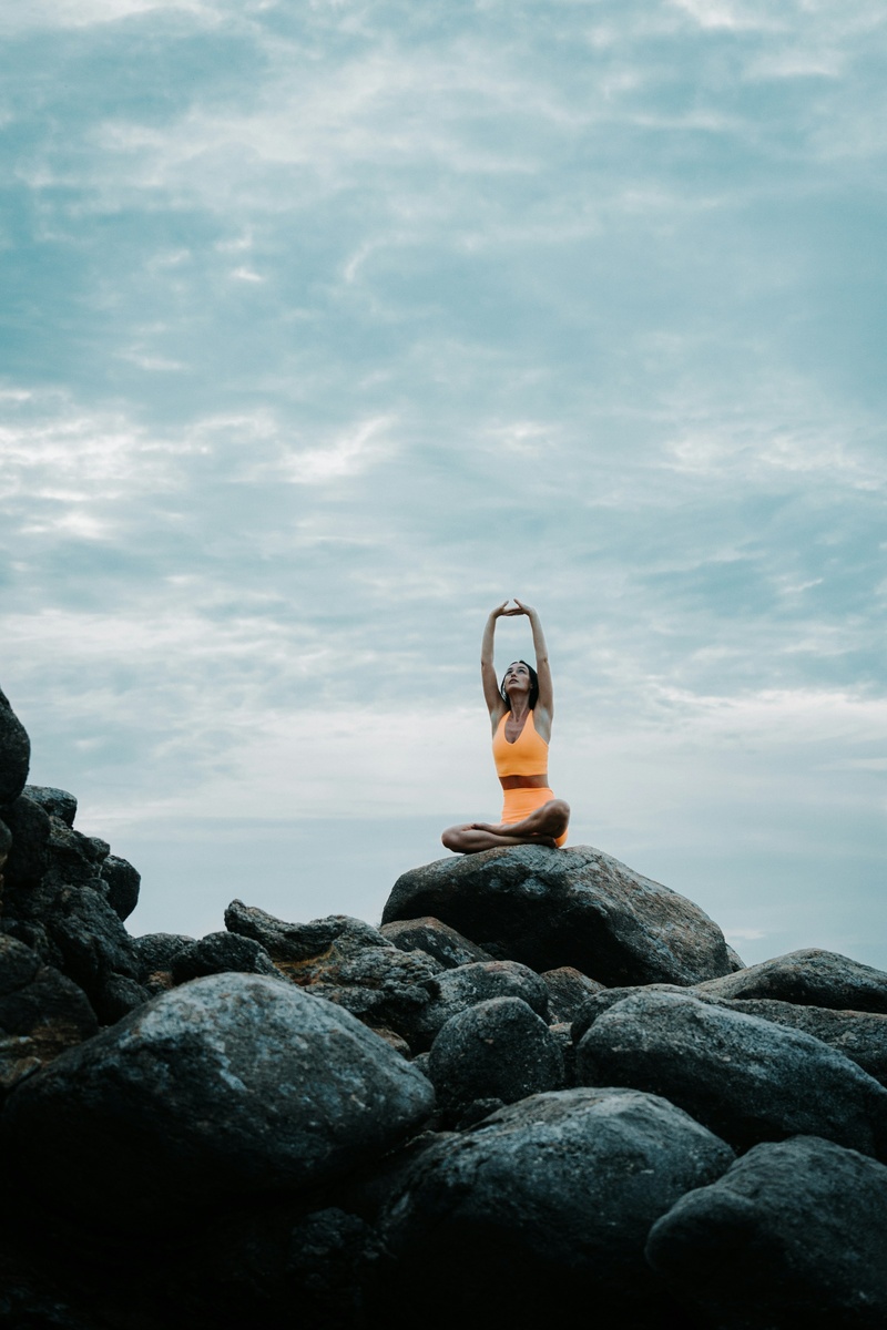 https://unsplash.com/photos/a-woman-is-doing-yoga-on-a-rock-yGRMUqKlAjA?utm_content=creditShareLink&utm_medium=referral&utm_source=unsplash