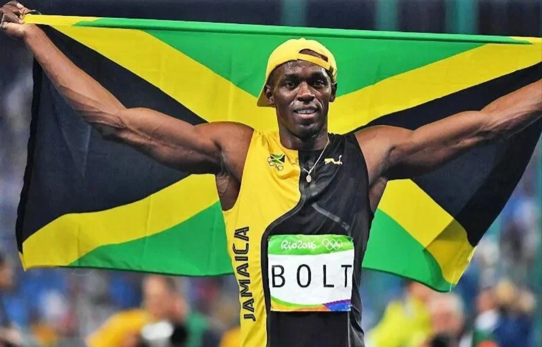 Усэйн Болт с флагом Ямайки