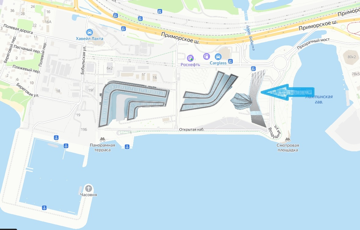 Вход находится в районе, куда указывает стрелка