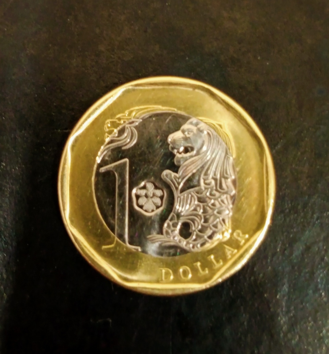Лицевая часть монеты 1 сингапурский доллар 2018г