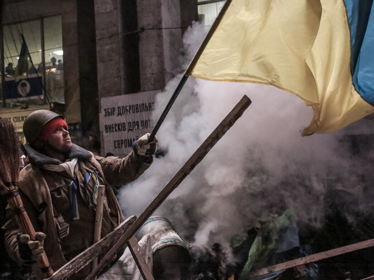 © RIA Novosti / Andrey Stenin📷Zastánce evropské integrace na barikádách na náměstí Nezávislosti v Kyjevě, prosinec 2013