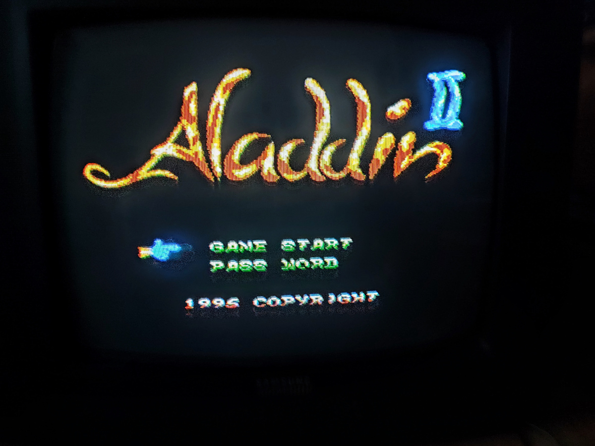 Фото сделаны мной. На фото игра "Аладдин. Оригинал игры "Aladdin" был разработан и издан Capcom в 1993г. для платформ SNES, Game Boy Advance. Геймдизайнер Синдзи Миками. Перенесенная на Денди игра "Аладдин" была разработана компанией Hummer Team, издана JY Company. Фото демонстрирует начальную заставку игры, а так же общий визуальный фон игры. Подробнее об этом рассказано в статье. Все материалы принадлежат правообладателям и размещены исключительно в информационных целях.