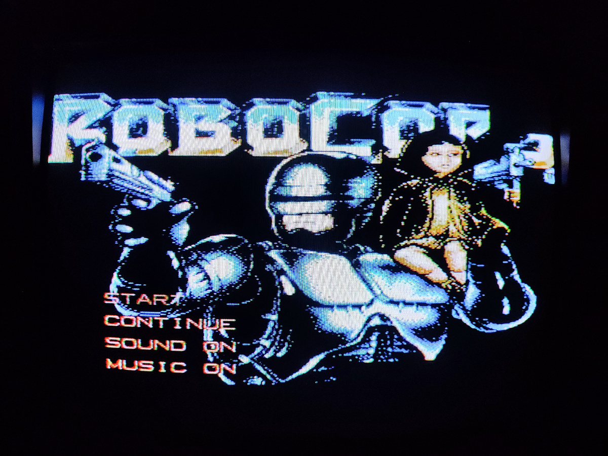 Фото сделаны мной. На фото игра "Робокоп. Оригинал игры "RoboCop 3" был разработан и издан Probe Software в 1992г. для платформы NES. Фото демонстрирует начальную заставку игры, а так же общий визуальный фон игры. Подробнее об этом рассказано в статье. Все материалы принадлежат правообладателям и размещены исключительно в информационных целях.