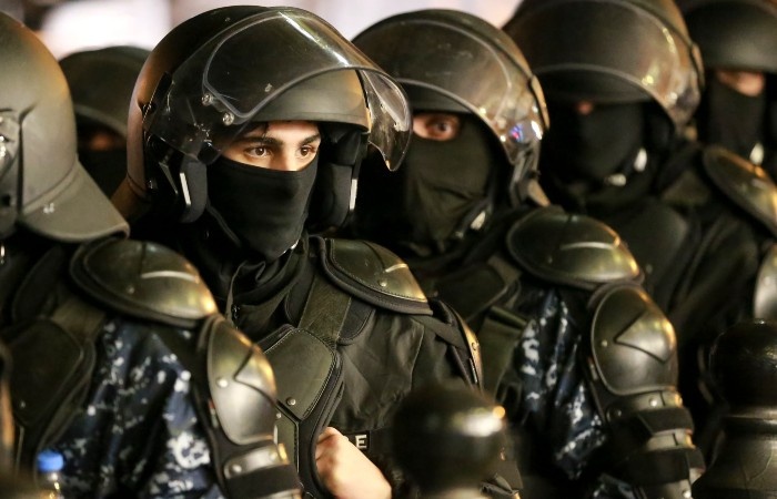    Police stand blocking a street during a rally outside the parliament's building to continue protests against the government's decision to suspend negotiations on joining the European Union in Tbilisi, Georgia, on Monday, Dec. 2, 2024. (AP Photo/Zurab Tsertsvadze) David Harutunov