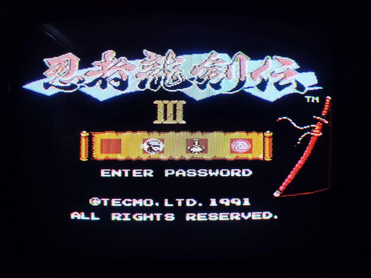 Фото сделаны мной. На фото игра "Ниндзя Рюкенден 3", "Ниндзя Гайден 3". Оригинал игры "Ninja Ryukenden 3: Yomi no Hakobune" был разработан и издан Tecmo в 1991,.г. для платформ NES, SNES, Atari Lynx. Геймдизайнер Масато Като. Фото демонстрирует начальную заставку игры, а так же общий визуальный фон игры. Подробнее об этом рассказано в статье. Все материалы принадлежат правообладателям и размещены исключительно в информационных целях.