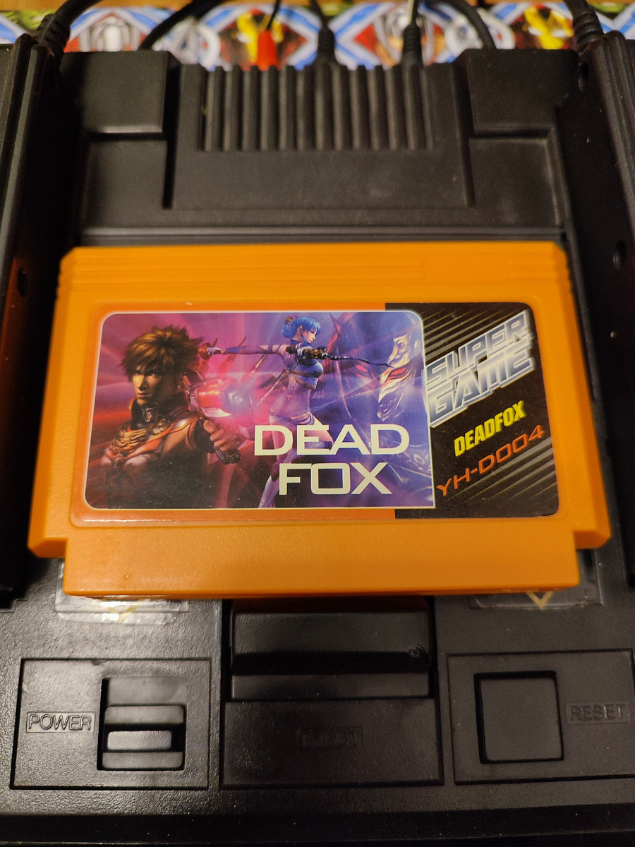 Фото сделаны мной. На фото игра "Dead fox". Оригинал игры "Code Name: Viper" был разработан  Arc System Works и издан  Capcom в 1990,.г. для NES. Фото демонстрирует начальную заставку игры, а так же общий визуальный фон игры. Подробнее об этом рассказано в статье. Все материалы принадлежат правообладателям и размещены исключительно в информационных целях.