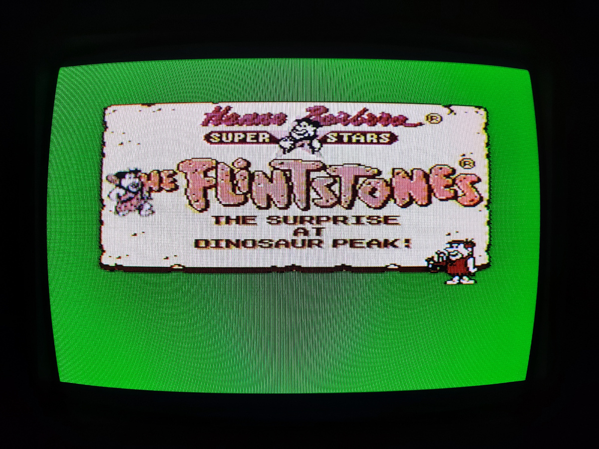 Фото сделаны мной. На фото игра "Flintstones 2". Оригинал игры "The Flintstones" был разработан Taito Corporation и издан Sega Interprises в 1993,.г. для Sega Mega Drive. Фото демонстрирует начальную заставку игры, а так же общий визуальный фон игры. Подробнее об этом рассказано в статье. Все материалы принадлежат правообладателям и размещены исключительно в информационных целях.