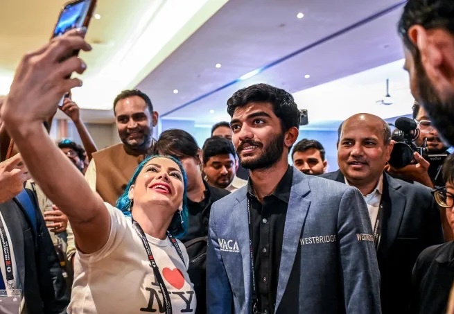 После победы Гукеша по всему миру прошли праздничные мероприятия. Саймон Лим /AFP / Getty Images.