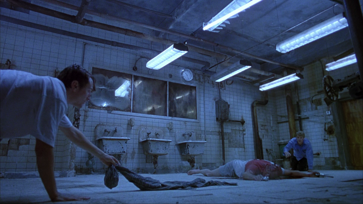 Кадр из фильма Пила: Игра на выживание (2004)