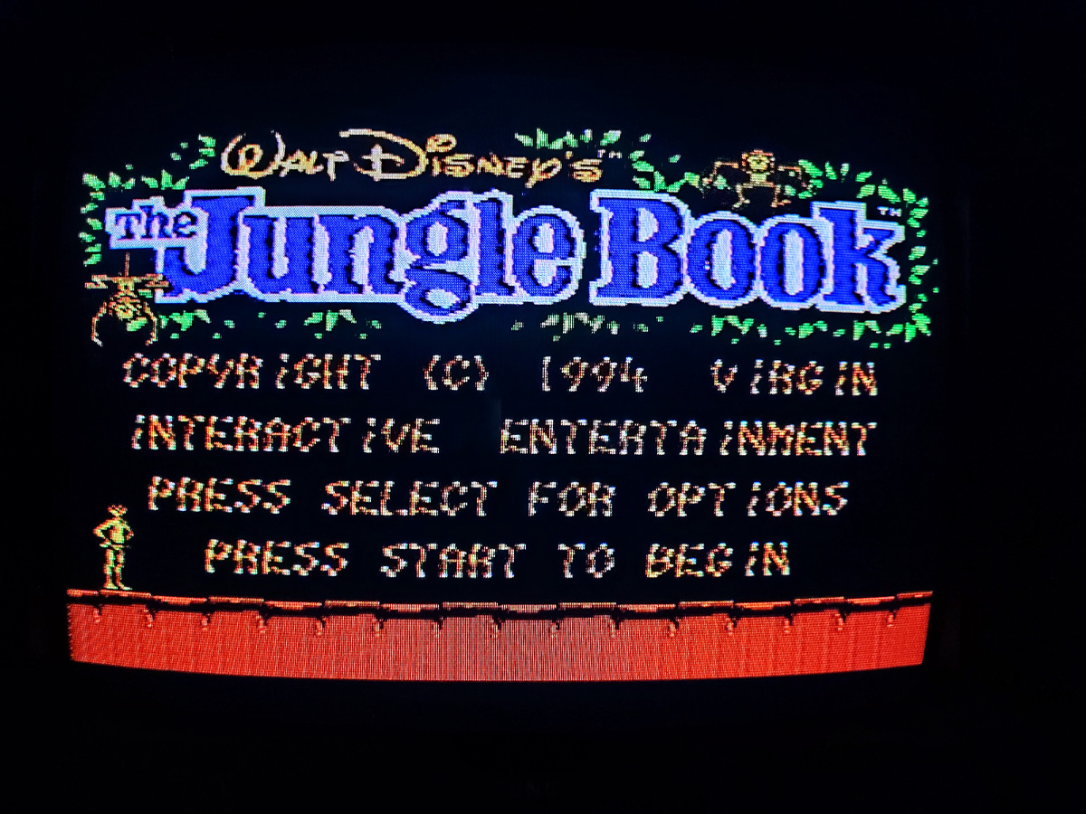 Фото сделаны мной. На фото игра Игра "Книга джунглей". Оригинал игры "The Jungle Book" был разработан Eurocom Entertainment Software и издан Virgin Interactive Entertainment в 1994,.г. для Sega Master System. Геймдизайнеры Дэвид Бишоп, Билл Андерсон, Эрик Ютео, Дэвид Перри, Робб Алви, Джулиан Ригналл. Фото демонстрирует начальную заставку игры, а так же общий визуальный фон игры. Подробнее об этом рассказано в статье. Все материалы принадлежат правообладателям и размещены исключительно в информационных целях.