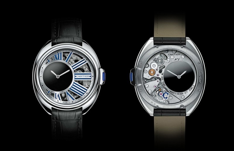 Часы Clé de Cartier Mysterious Hour Watch с лицевой и обратной стороны с еще одним циферблатом. Часовой механизм как будто левитирует вокруг циферблата. Диаметр часов 41 мм, корпус изготавливается: из розового золота или палладия.