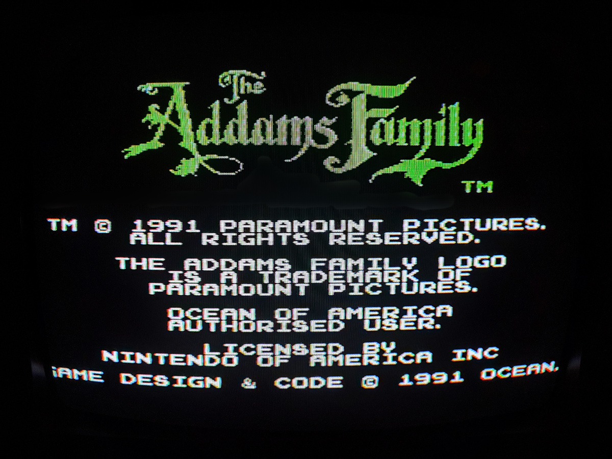 Фото сделаны мной. На фото игра "Addams Family". Оригинал игры "The Addams Family" был разработан Ocean Software и издан Ocean в 1992,.г. для приставок Sega Mega Drive, Super NES, Commodore Amiga и Atari ST, затем и на другие консоли. Фото демонстрирует начальную заставку игры, а так же общий визуальный фон игры. Подробнее об этом рассказано в статье. Все материалы принадлежат правообладателям и размещены исключительно в информационных целях.