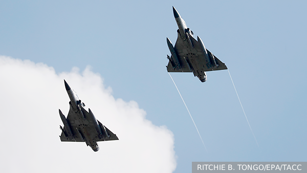     Фото: RITCHIE B. TONGO/EPA/ТАСС   
 Текст: Валерия Вербинина