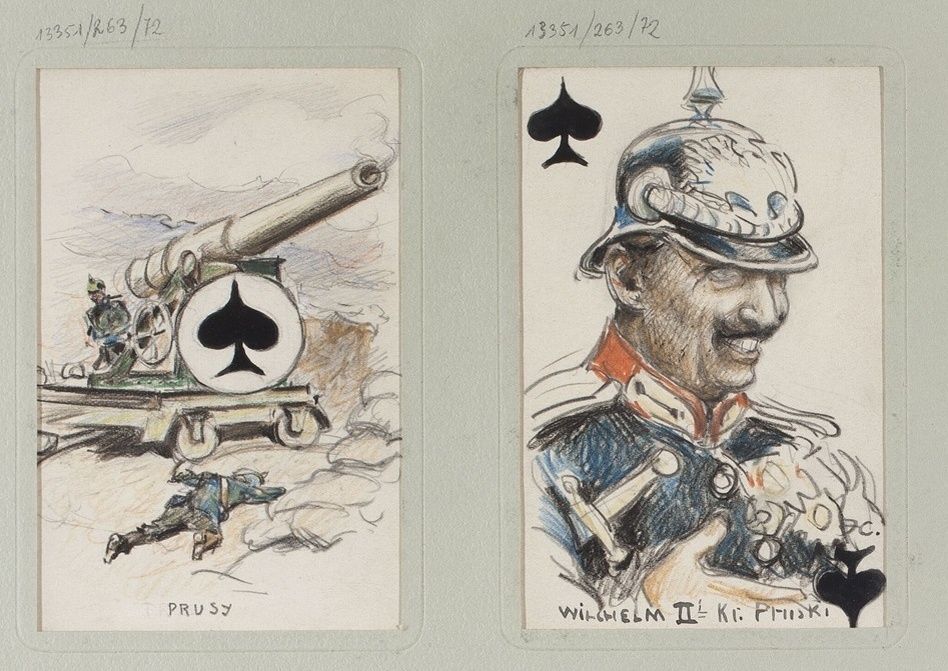 - Туз Пик (♠) Аллегория Пруссии.
Изображены артиллерийское орудие и военные действия. Подпись: "Prusy" (Пруссия на польском языке).
- Король Пик (♠) Вильгельм II, последний немецкий император (кайзер) и король Пруссии.
Подпись: "Wilhelm II K.K. Pruski" (Кайзер Вильгельм II).