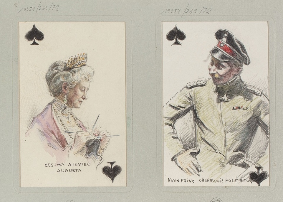 - Дама Пик (♠) Августа Виктория, супруга Вильгельма II, императрица Германии и королева Пруссии.
Подпись: "Ces-Wa Niemiec Augusta" (Императрица Германии Августа на польском).
- Валет Пик (♠) Кронпринц Пруссии.
Подпись: "Kron Princ Obsługa Polska" .