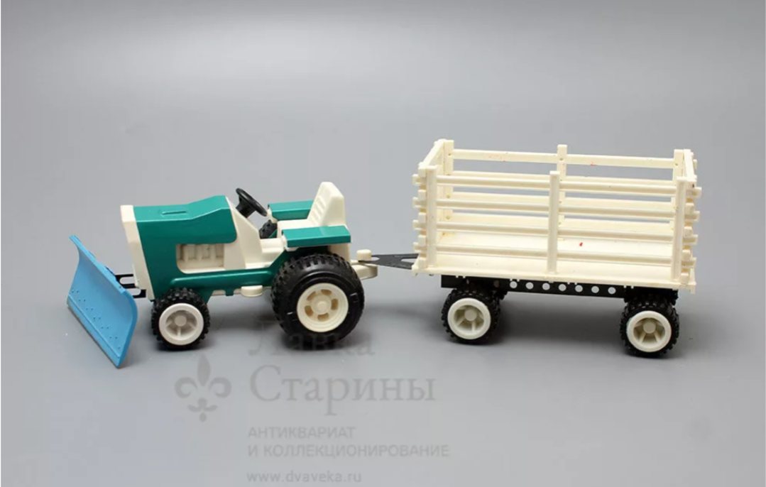 https://www.dvaveka.ru/raznoe/igrushki/sovetskaya-detskaya-igrushka-traktor-petrusha-s-pritsepom-plastmassa-zavod-severnyy-press-1980-e-gody/