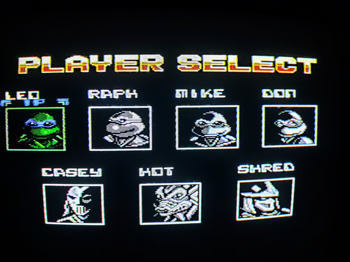 Фото сделаны мной. На фото игра "Ninja Turtles: Tournament Fighters". Оригинал игры "Teenage Mutant Ninja Turtles: Tournament Fighters" был разработан и издан Konami в 1993,.г. для приставки NES, SNES и SEGA Genesis. Сценарист Тосики Иноуэ. Фото демонстрирует начальную заставку игры, а так же общий визуальный фон игры. Подробнее об этом рассказано в статье. Все материалы принадлежат правообладателям и размещены исключительно в информационных целях.