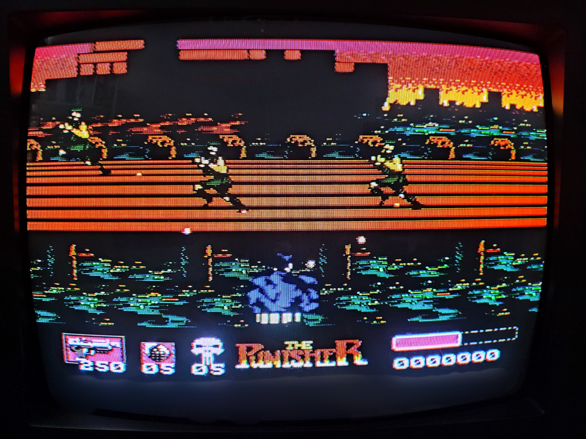 Фото сделаны мной. На фото игра "The Punisher". Оригинал игры "The Punisher" был разработан Beam Software и издан LJN Ltd в 1990,.г. для приставки NES, Game Boy. Дизайнеры Грегг Барнетт, Пол Кидд. Фото демонстрирует начальную заставку игры, а так же общий визуальный фон игры. Подробнее об этом рассказано в статье. Все материалы принадлежат правообладателям и размещены исключительно в информационных целях.