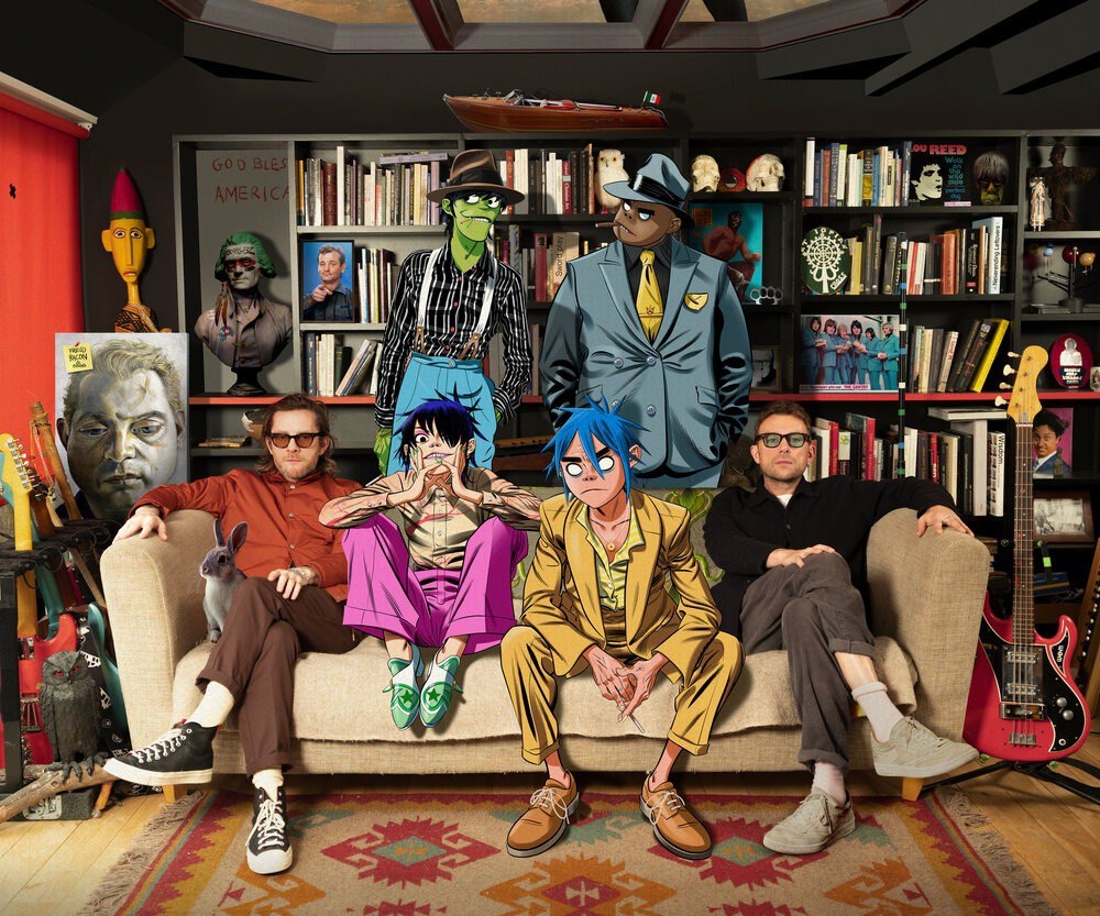 Персонажи Gorrilaz вместе с Деймоном Алберном(справа) и Джейми Хьюлеттом(слева)