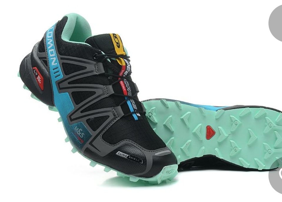 Значок красный contagrip и характерная разнонаправленная ёлочка на подошве Salomon