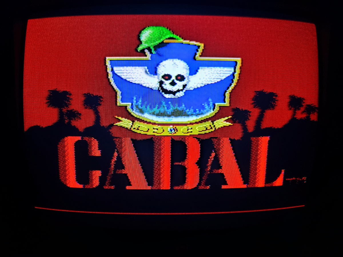 Фото сделаны мной. На фото игра "Cabal". Оригинал игры "Cabal" был разработан  TAD Corporation и издан  Taito, Fabtek,  Capcom в 1988г. для платформ Arcade, Amiga, Amstrad CPC, C64, ZX Spectrum, MS-DOS, NES. Фото демонстрирует начальную заставку игры, а так же общий визуальный фон игры. Подробнее об этом рассказано в статье. Все материалы принадлежат правообладателям и размещены исключительно в информационных целях.