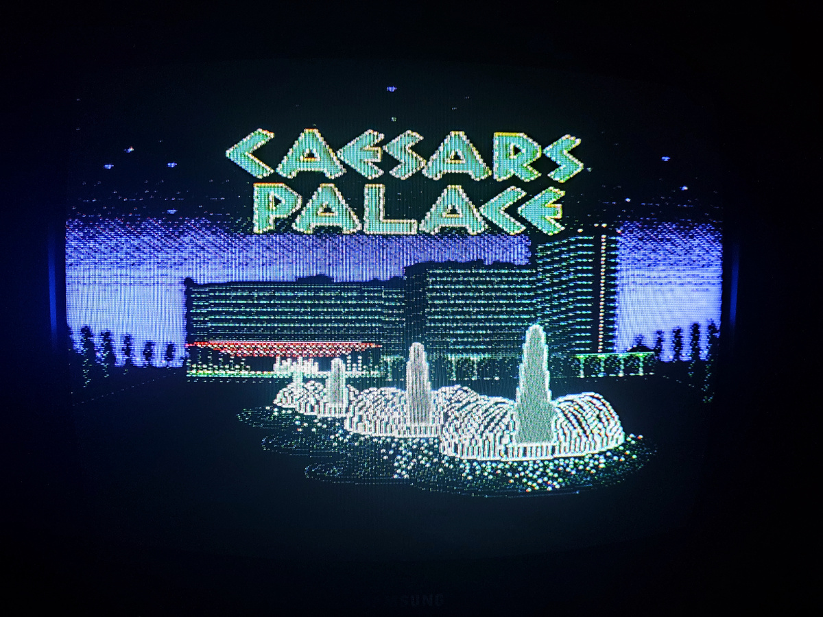 Фото сделаны мной. На фото игра "Сизарс Палас".Оригинал игры "Caesars Palace" был разработан и издан Virgin Mastertronic International Inc. в 1990г. для DOS, NES. Фото демонстрирует начальную заставку игры, а так же общий визуальный фон игры. Подробнее об этом рассказано в статье. Все материалы принадлежат правообладателям и размещены исключительно в информационных целях.