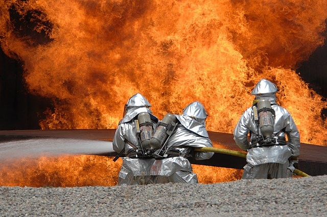    U.S. Air Force Airmen from the 20th Civil Engineer Squadron Fire Protection Flight neutralize a live fire during a field training exercise at Shaw Air Force Base in South Carolina May 23, 2007. The exercise includes training in self-aid buddy care, expedient firefighting, weapons handling, and night-vision devices. DoD photo by Airman 1st Class Kathrine McDowell, U.S. Air Force. (Released) Василий Соколов