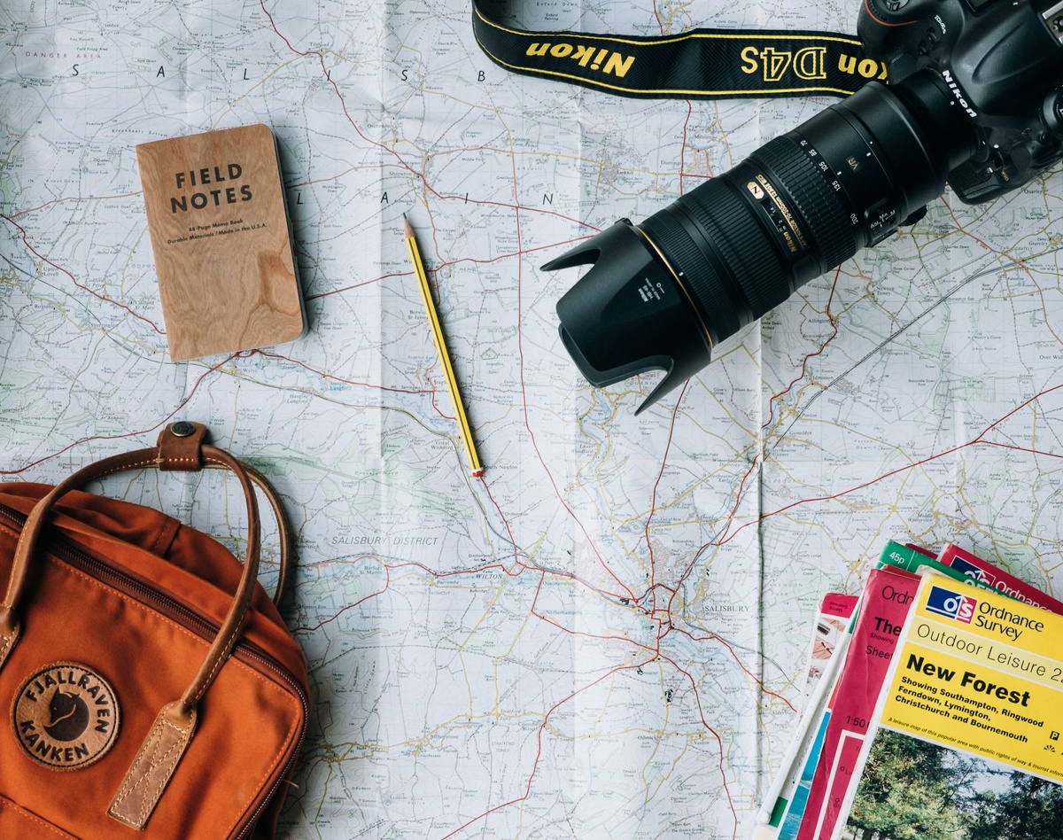 https://unsplash.com/photos/flat-lay-photography-of-camera-book-and-bag-qyAka7W5uMY?utm_content=creditShareLink&utm_medium=referral&utm_source=unsplash