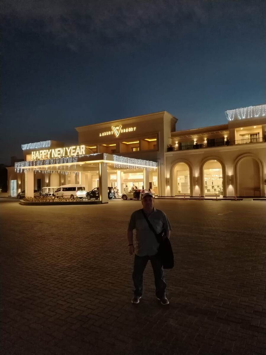 У входа в отель.