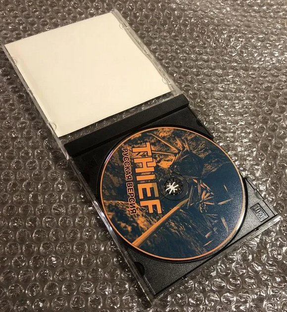 Цветной принт с названием игры Thief на CD-диске