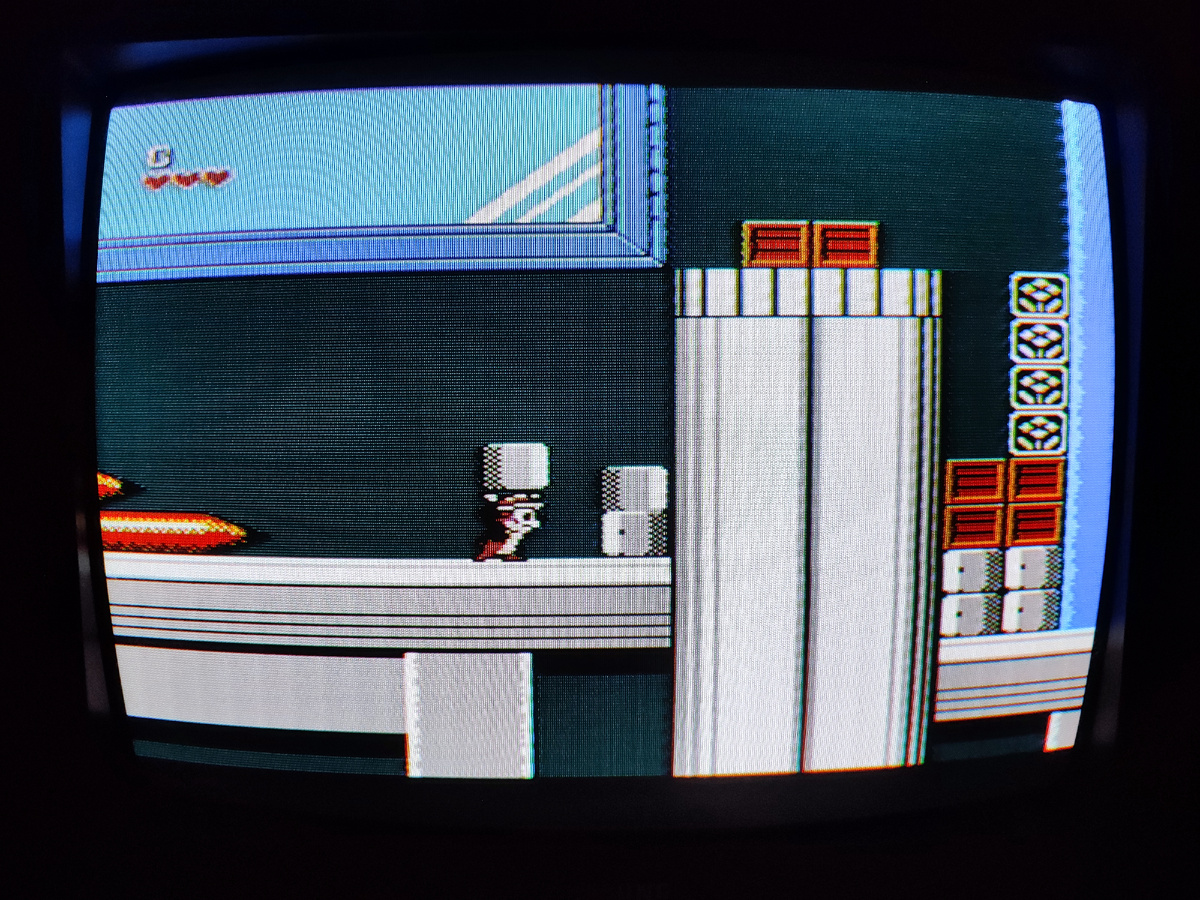 Фото сделаны мной. На фото игра "Chip Dale 1". Оригинал игры "Chip ’n Dale Rescue Rangers" был разработан и издан Capcom. в 1990г. для NES. продюсеры Токуро Фудзивара, Дарлин Уоддингтон, дизайнер Масаёси Курокава. Фото демонстрирует начальную заставку игры, а так же общий визуальный фон игры. Подробнее об этом рассказано в статье. Все материалы принадлежат правообладателям и размещены исключительно в информационных целях.