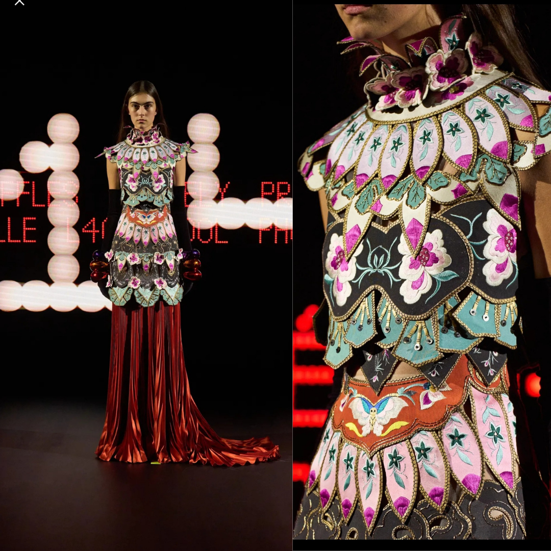 Я так понимаю, что топ собран из нескольких деталей. Как и юбка. За счёт этого немного напоминает латы рыцаря.