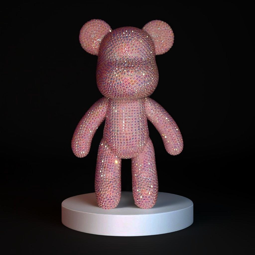 На фото фигурка из винила в форме мишки, выложенная стразами. Ручная работа.