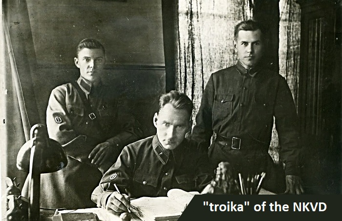 Это не "тройка НКВД", как написано на фото, а просто какие-то сотрудники НКВД. "Тройка НКВД", а точнее, Коллегия включала в себя в обязательном порядке руководителя управления НКВД СССР в субъекте (республике, крае, области), секретаря областного комитета ВКП(б) и местного прокурора
 