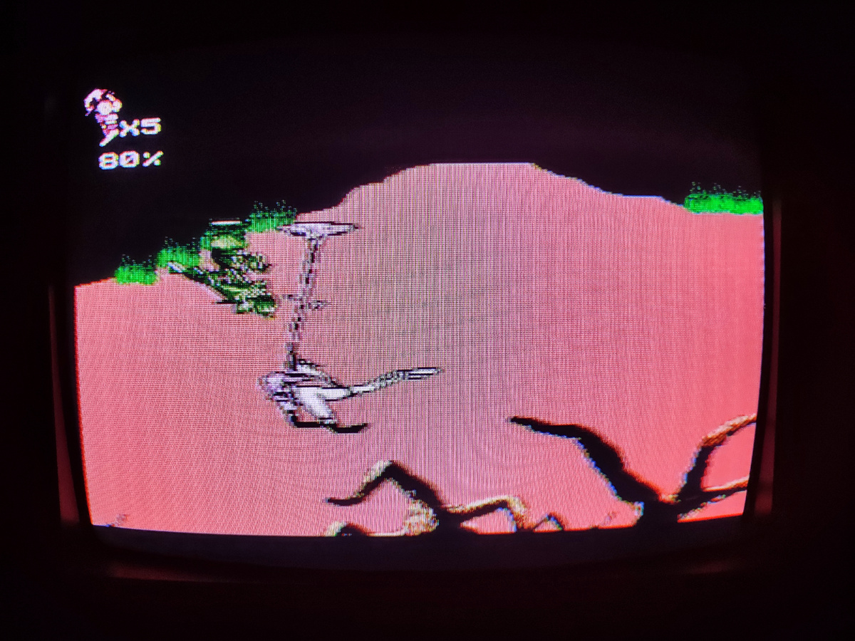 Фото сделаны мной. На фото игра "Earth worm Jim 2". Оригинал игры "Earthworm Jim 2", 1995г., был разработан Shiny Entertainment и издан Virgin Interactive, Playmates для платформ Mega Drive Genesis, SNES. Продюсеры Дэвид А. Люманн, Скотт Херрингтон, геймдизайнеры Дэвид Перри, Дуглас Тен-Нэйпел. Перенос с Mega Drive на Famicom был сделан китайским разработчиком портов "Super Game". Фото демонстрирует начальную заставку игры, а так же общий визуальный фон игры. Подробнее об этом рассказано в статье. Все материалы принадлежат правообладателям и размещены исключительно в информационных целях.