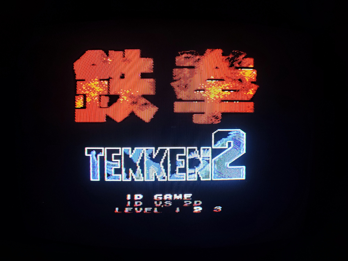 Фото сделаны мной. На фото хак игры Tekken 2. Игра "Tekken 2" (8bit), это пиратский порт игры "Tekken 1". Данная пиратская самоделка от студии "Hummer Team",  изданная J.Y. Company в 1996 г., лишь отдаленно напоминает оригинальную игру. Оригинал игры "Tekken 1" был разработан Namco и издан Namco, Sony Computer Entertainment в 1994г. для аркадных автоматов и портирован на PlayStation 1. Директор и дизайнер Сейити Ишии, программист Масанори Ямада. Фото демонстрирует начальную заставку игры, а так же общий визуальный фон игры. Подробнее об этом рассказано в статье. Все материалы принадлежат правообладателям и размещены исключительно в информационных целях.