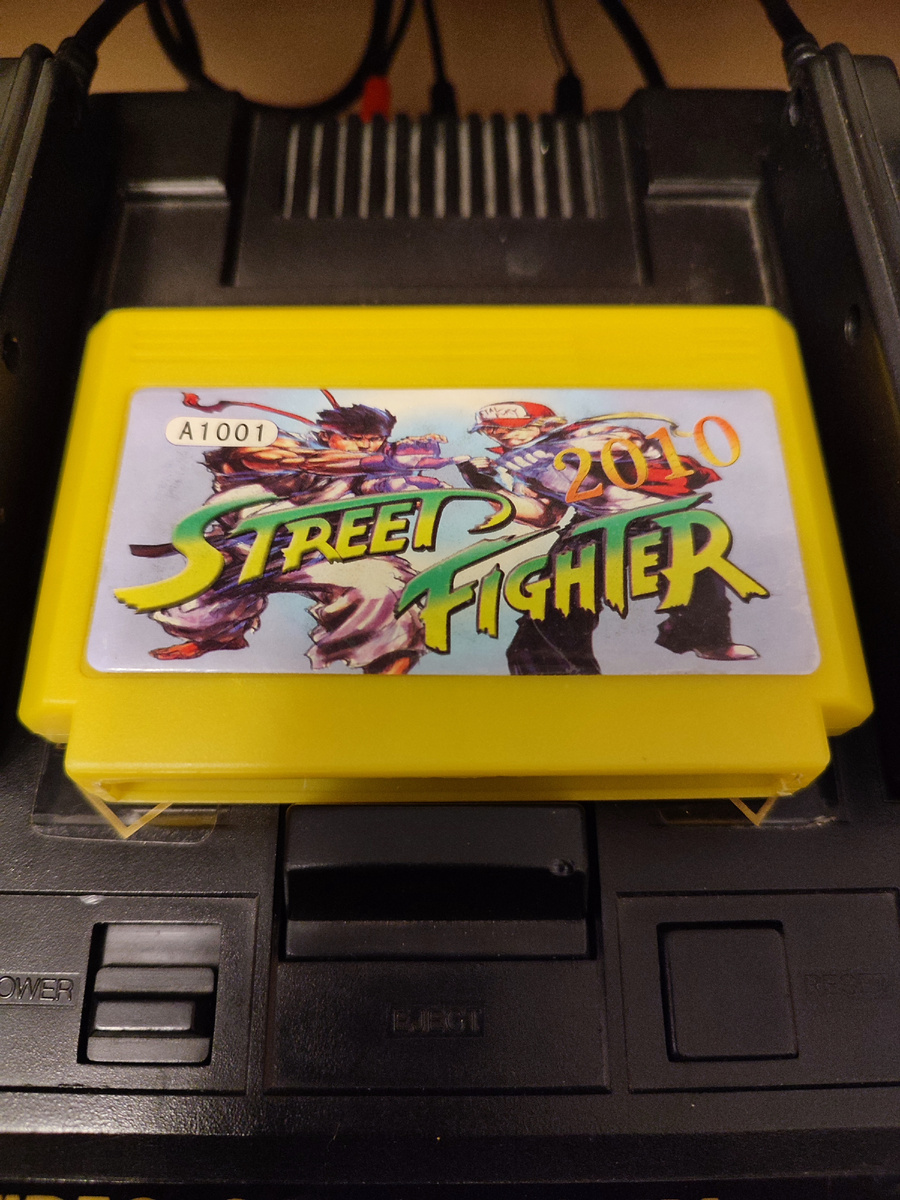 Фото сделаны мной. На фото игра "Street Fighter 2010". Оригинал игры "Street Fighter 2010: The Final Fight" был разработан и издан Capcom. в 1990г. для NES. Продюсер Токуро Фудзивара, дизайнер Хисаши Ямамото, программисты Нобуюки Мацусима, Кодзи Ёсида. Фото демонстрирует начальную заставку игры, а так же общий визуальный фон игры. Подробнее об этом рассказано в статье. Все материалы принадлежат правообладателям и размещены исключительно в информационных целях.