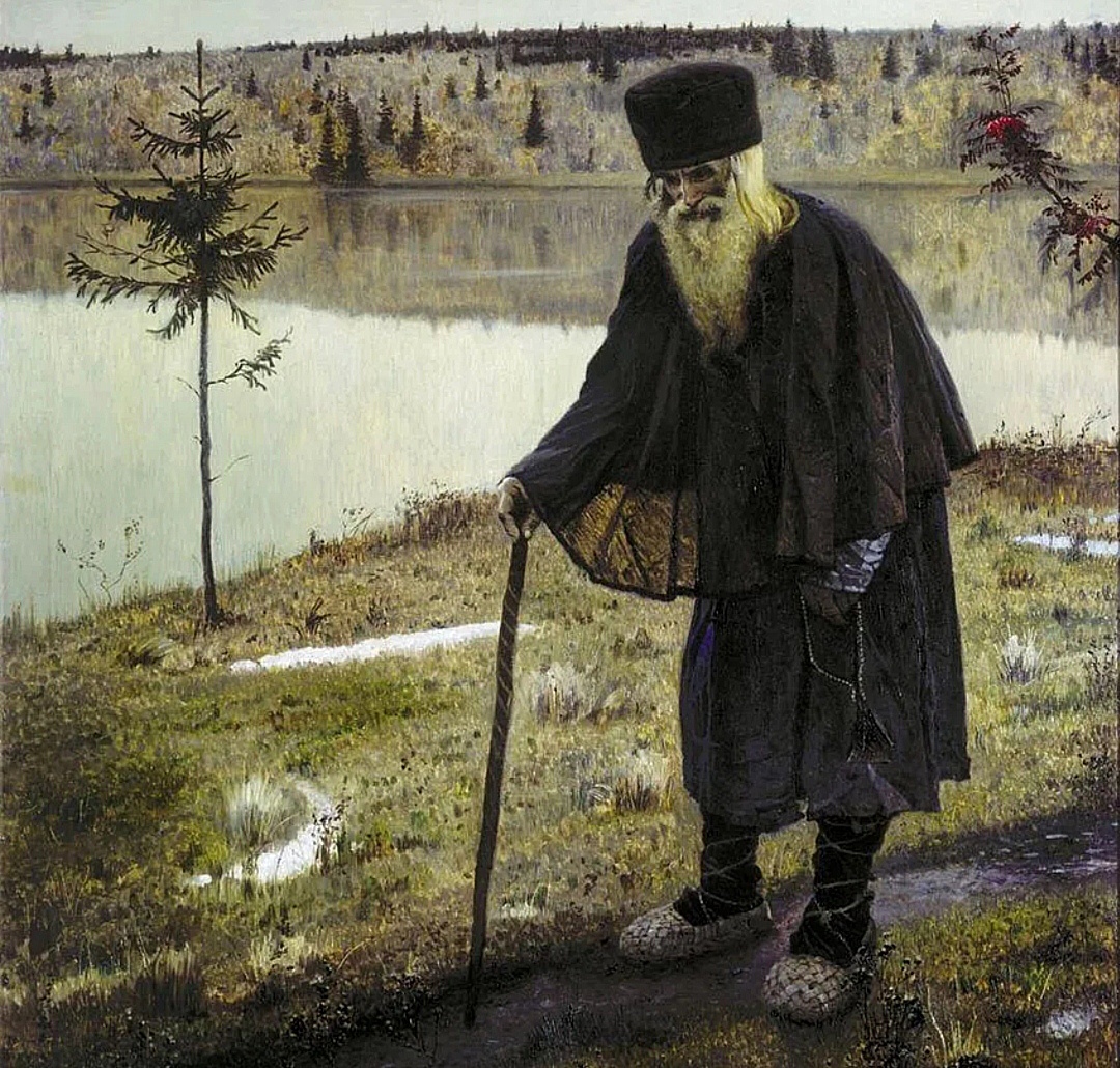 Человек в длинном пальто упёртый на палку.