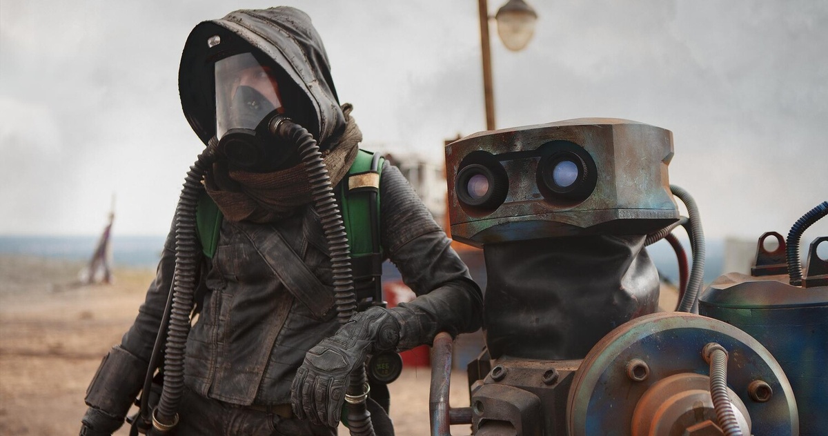 Кадр из фильма. Человек+робот в постапокалиптическом мире. Где-то мы это уже видели...