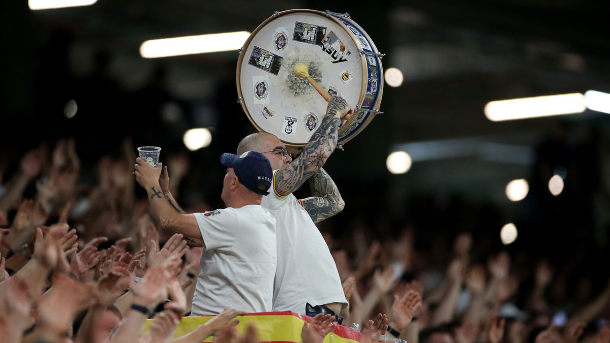    MADRID, SPAIN - APRIL 21: A fan of Real Madrid shows their support whilst playing a drum during the LaLiga EA Sports match between Real Madrid CF and FC Barcelona at Estadio Santiago Bernabeu on April 21, 2024 in Madrid, Spain. (Photo by Florencia Tan Jun/Getty Images) admin